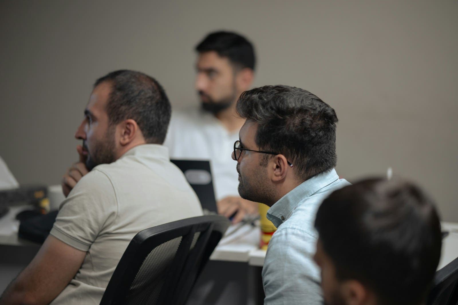 Developers working together on laptops